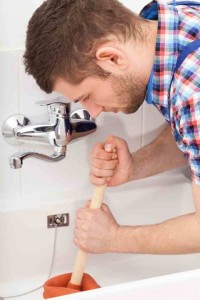 plumber plunging drain