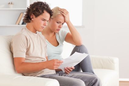 2 people looking at their bill